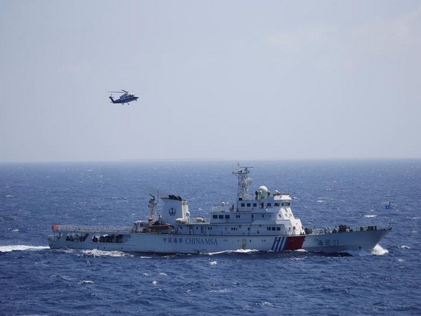 Chinese ship and helicopter seen during a search and rescue exercise near Paracel Islands