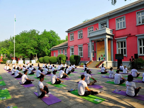 Indians practising yoga on International Yoga Day on Sunday. (Photo credit: official twitter)