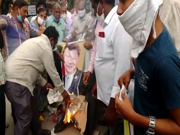 The protesters set ablaze the effigy of Chinese President Xi Jinping in Telangana's Suryapet on Sunday. Photo/ANI