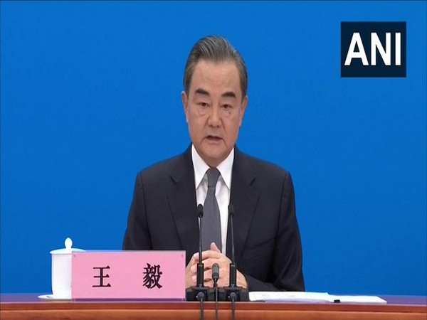 China's Foreign Minister Wang Yi addresses a press briefing on Sunday