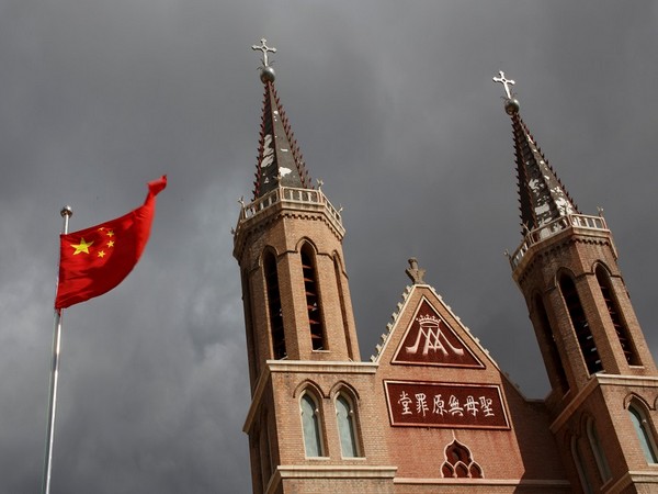 Chinese national flag flies in front of a Catholic underground church. (Photo Credit - Reuters)