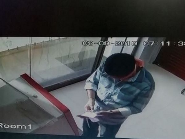 The accused Chinthala Suresh Babu at an ATM in Krishna District [Photo/ANI]