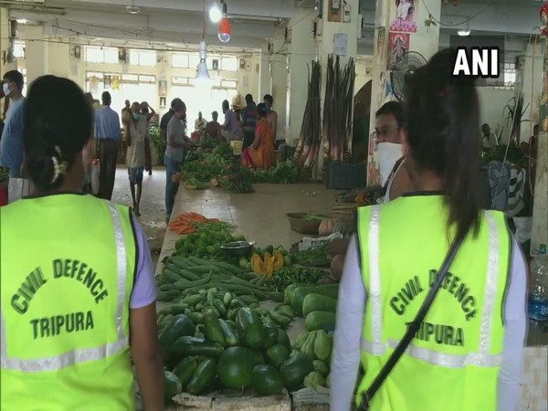 Civil Defence volunteers deployed to ensure that social distancing norms in Agartala vegetable market.