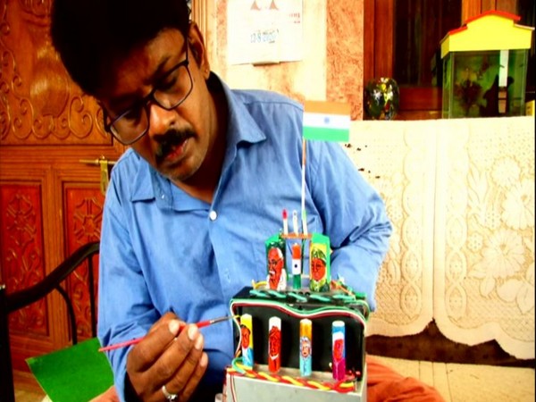 Coimbatore based miniature artist, Raja draws images of freedom fighters on cell batteries. (Photo/ANI)