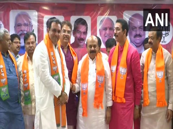 Pramod Madhwaraj joining BJP along with other party leaders in the presence of Karnataka Chief Minister Basavaraj Bommai on Saturday. [Photo/ANI]