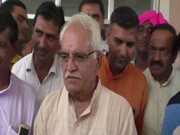 Congress MLA Anand Singh Dangi talking to reporters on Tuesday after filing his nomination. Photo/ANI