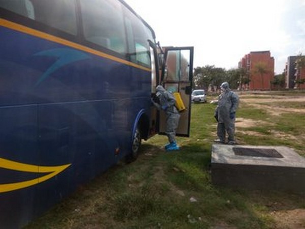 The bus in which the Italian passengers traveled, being disinfected by ITBP personnel at Chhawla camp on Sunday.