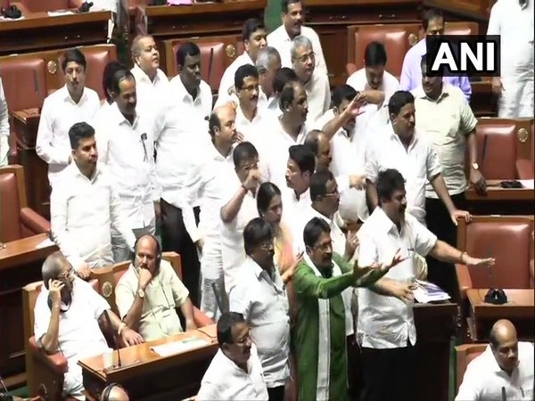 Congress-JDS MLAs raising slogans -- Save the Constitution -- in the Vidhana Soudha on Monday. Photo/ANI 