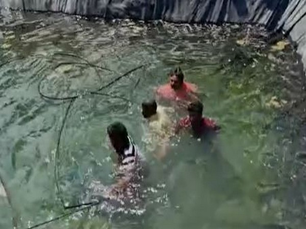 Bodies of the electrocuted couple being pulled out from the borewell from Telangana's Siddipet district.