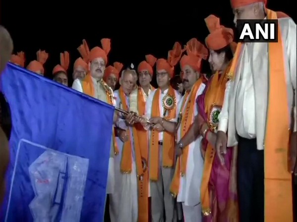 Advisor to the Governor in Jammu and Kashmir, K K Sharma flagging off the first batch of devotees for Amarnath Yatra in Jammu on Sunday. Photo/ANI