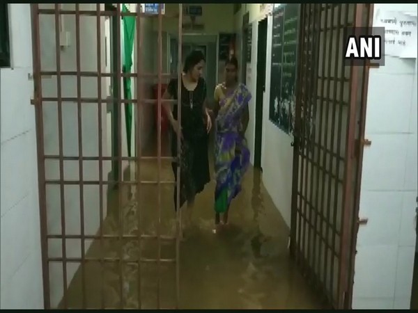 In the hospital, doctors, patients and their family members could be seen wading through the water-filled corridors and wards. Photo/ANI