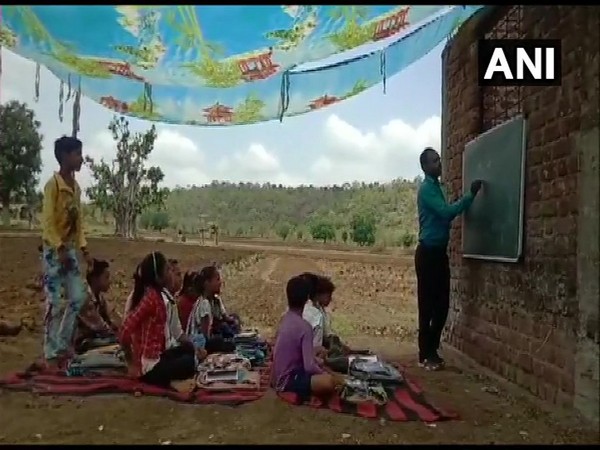 Students of government school in Dewas' Dokar Kheda village, Madhya Pradesh, study under tents in severe heatwave condition