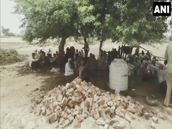 Villagers stage a protest. Photo/ANI