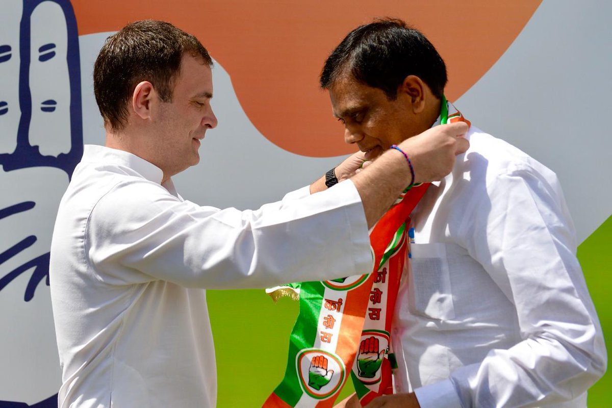 Congress president Rahul Gandhi (L) with Ashok Kumar Dohre in Bhopal, Madhya Pradesh on Friday. [Photo/ANI]