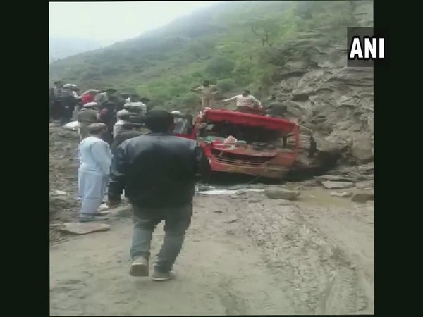 Passengers being rescued from the damaged bus.