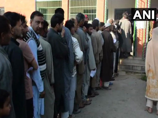 People at a polling booth in Khrew area of  Pulwama in Jammu and Kashmir.