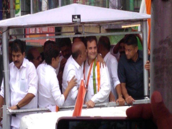A supporter kisses Congress President Rahul Gandhi during a roadshow in Wayanad district of Kerala on Sunday. (Photo/ANI)