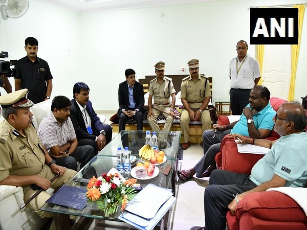 Karnataka CM HD Kumaraswamy holds a meeting with officials before his 'village stay programme' in Raichur. [Photo/ANI]