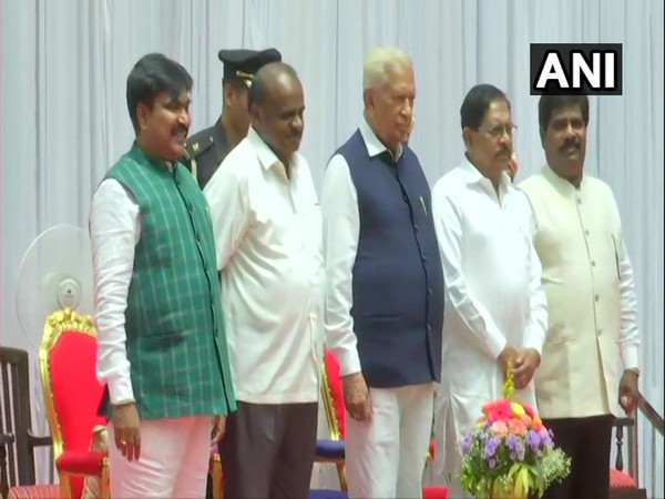 R Shankar and H Nagesh with Chief Minister HD Kumaraswamy at Rajbhavan on Friday. Photo/ANI