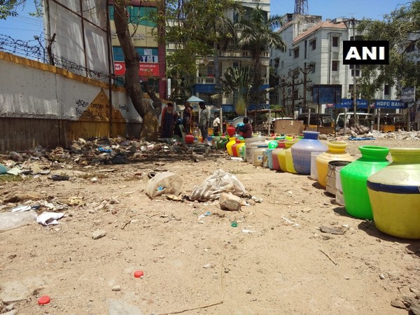 Locals line up to collect water in Chennai. (Photo:ANI)
