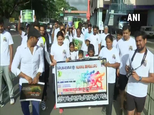 With an aim to spread awareness about climate change and depleting water levels in the state, people marched across the city on Sunday morning. Photo/ANI