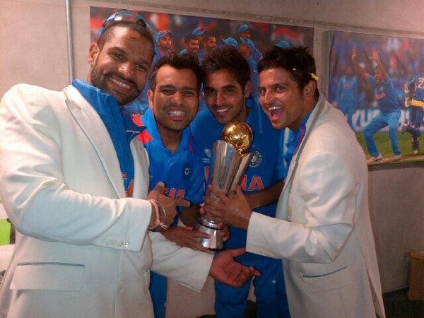 Rohit Sharma, Shikhar Dhawan, Bhuveshwar Kumar and Suresh Raina with the Champions Trophy title (Photo/Rohit Sharma Twitter)