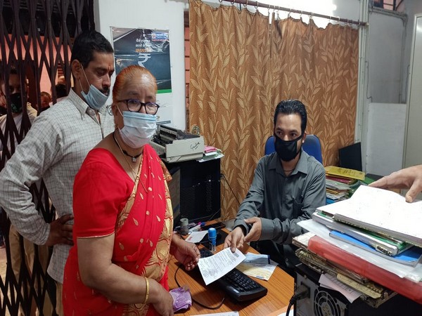 Devki Bhandari handed a cheque of Rs 10 lakh to Uttarakhand state officials for fighting coronavirus. [Photo/ANI]