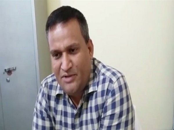 DM Amrit Tripathi speaking to ANI in Shahjahanpur. Photo/ANI