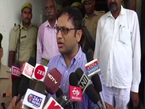 District Magistrate Sripati Mishra speaking to reporters on Sunday.