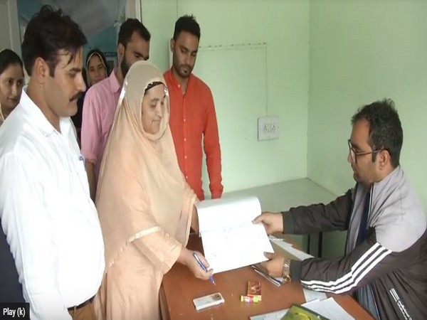 Sharifa Begum, a 64-year-old woman, filing her nomination for Block Development Council polls in Doda district. Photo/ANI