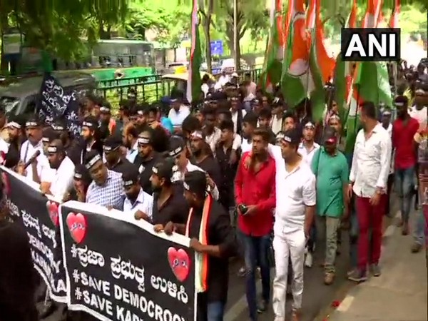 Youth Congress workers march from Cubbon Park to Raj Bhawan in Bengaluru on Tuesday. (Photo/ANI)