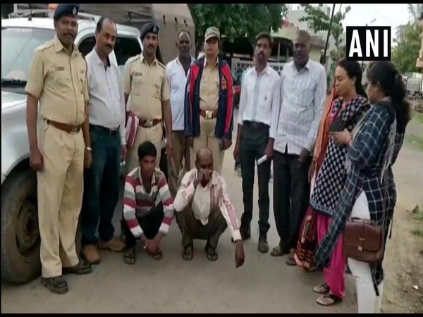 Police officials with the two accused. Photo/ANI