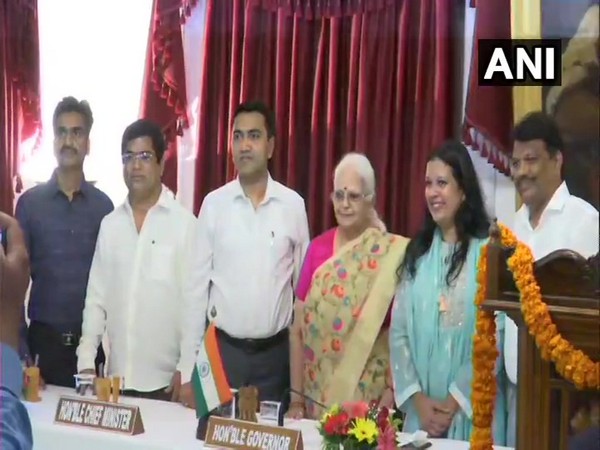 Goa Governor Mridula Sinha, Chief Minister Pramod Sawant along with newly inducted ministers at Raj Bhawan in Panaji, Goa on Saturday. Photo/ANI  