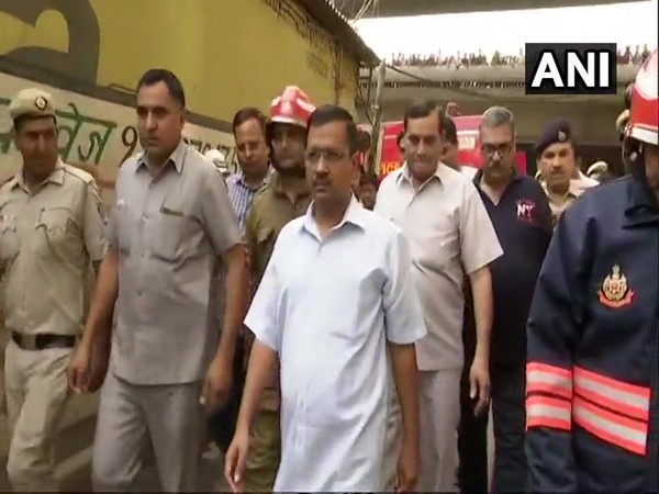Chief Minister Arvind Kejriwal visiting rubber factory which was gutted in a fire in Jhilmil Industrial area on Saturday. Photo/ANI