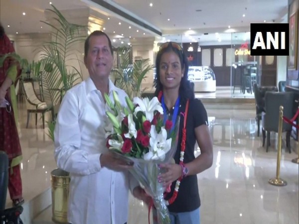 BJD MP Achyuta Samanta with sprinter Dutee Chand