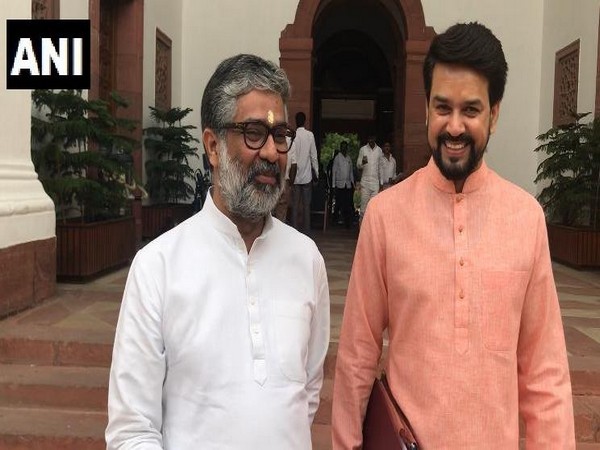Samajwadi Party leader Neeraj Shekhar with BJP's Anurag Thakur outside the Parliament on Tuesday. [Photo/ANI]