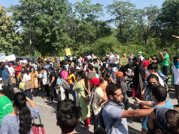People protest against planned felling of 10k trees for airport expansion in Dehradun on Sunday. Photo/ANI