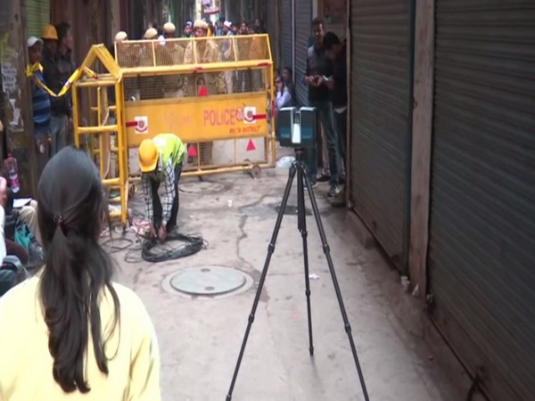 A team of Crime Branch of Delhi Police conducting 3D image mapping at Anaj Mandi area in New Delhi on Monday. Photo/ANI