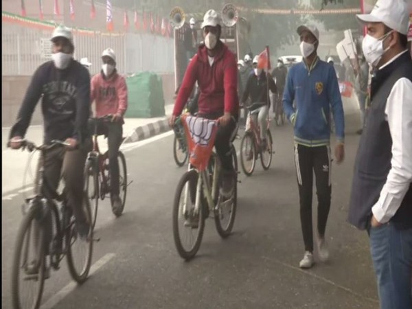 Delhi BJP Yuva Morcha members at the cycle rally on Monday. (Photo/ANI)