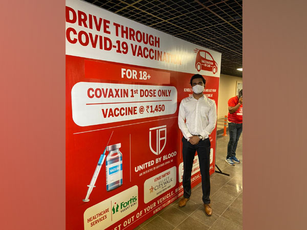 Delhi Deputy Commissioner Abhishek Singh during drive-through COVID-19 vaccination at Saket mall in Delhi on Thursday. [Photo/ANI]