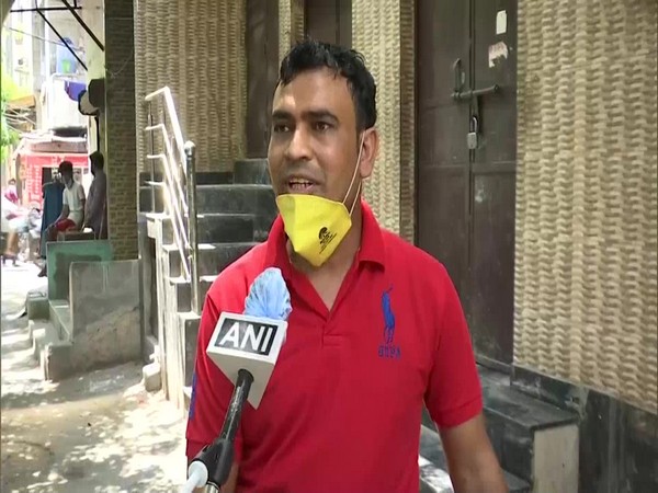 Wazir Singh, an English teacher who is selling vegetables in Delhi speaks to ANI. (Photo/ANI)