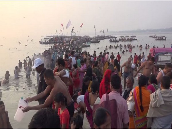 Devotees taking a holy dip at Sangam, Prayagraj. Photo/ANI