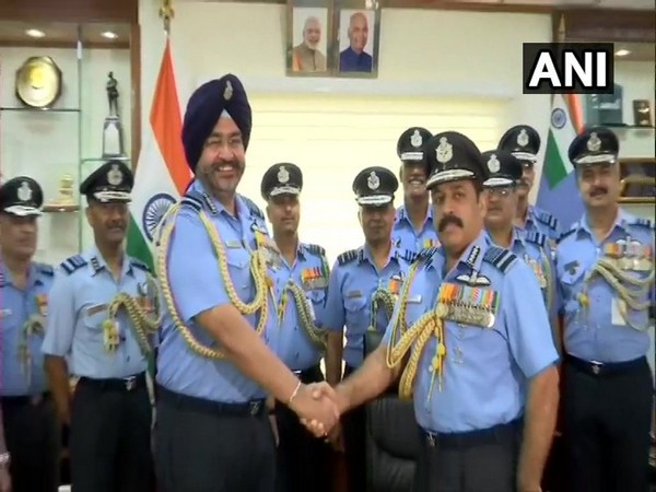 Air Chief Marshal BS Dhanoa with the new IAF Chief of Staff Air Marshal RKS Bhadauria in New Delhi on Monday. Photo/ANI