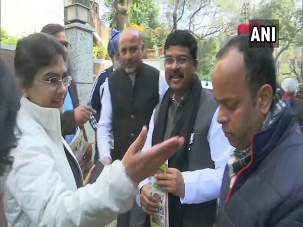 Union Minister of Petroleum and Natural Gas, Dharmendra Pradhan meets residents of Malviya Nagar colony during door to door campaign on Sunday Photo/ANI