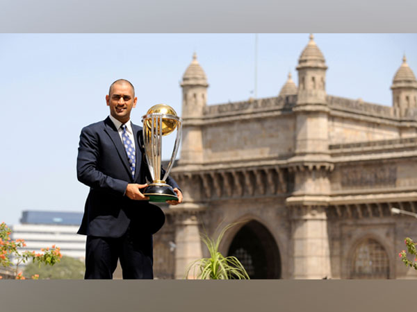 MS Dhoni with the 2011 World Cup trophy (Reuters image)