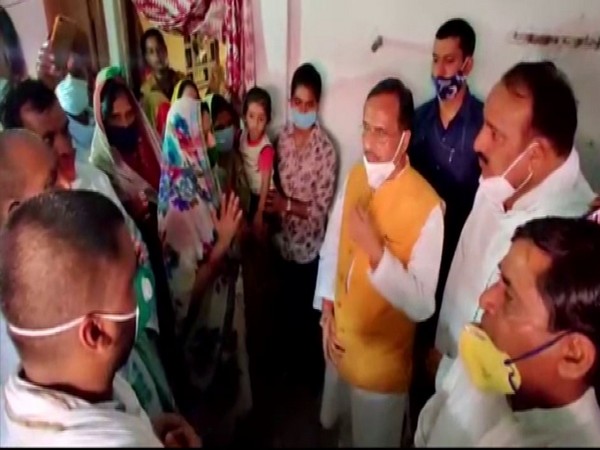 UP Deputy CM Dinesh Sharma with slain SI Mahesh Yadav's family members in Raebareli on Tuesday. (Photo/ANI)