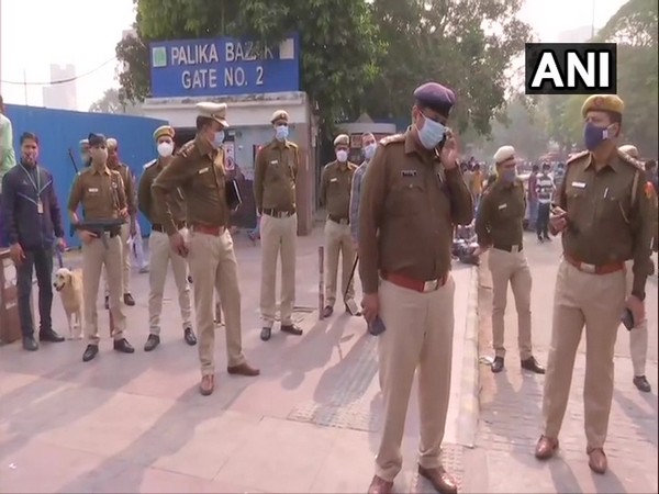 Delhi Police personnel monitoring security at Palika Bazar in Delhi.