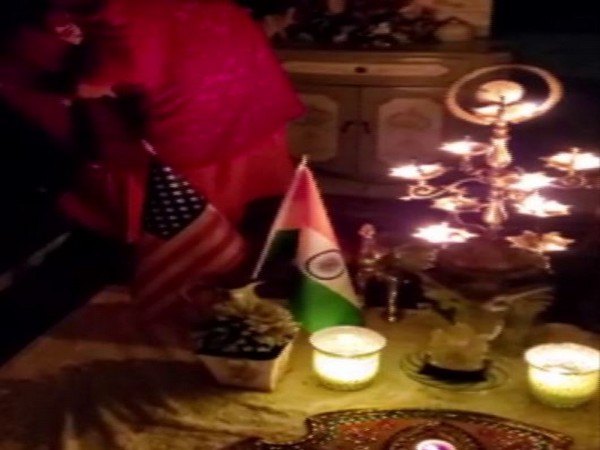 Indian-American community members in New Jersey light diyas on Sunday night