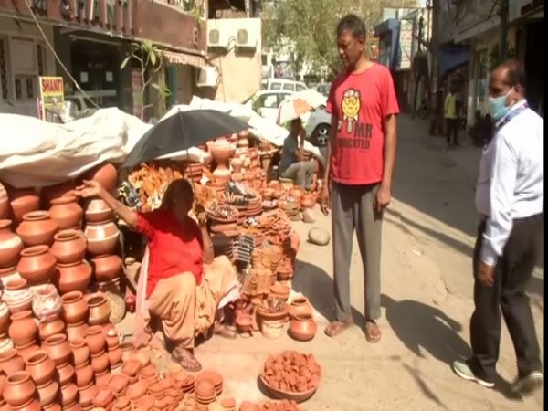 A Woman sells earthen lamps in Delhi on Sunday. Photo/ANI