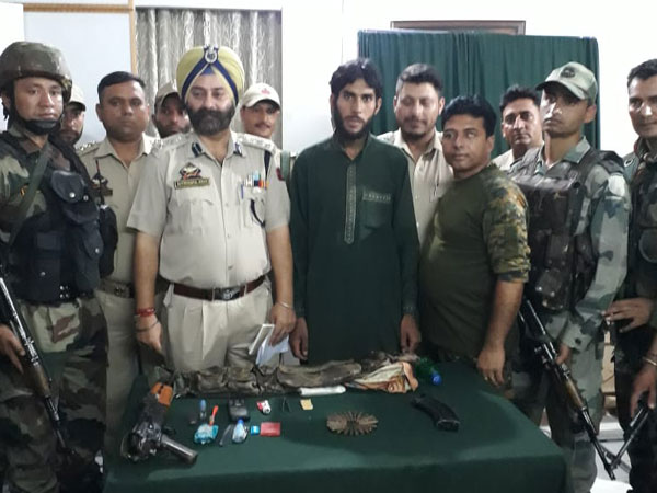 The captured LeT terrorist with the joint operations team in Doda. Photo/ANI